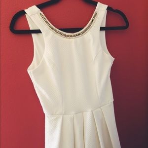 White mini dress w/ bow and pearl neckline detail